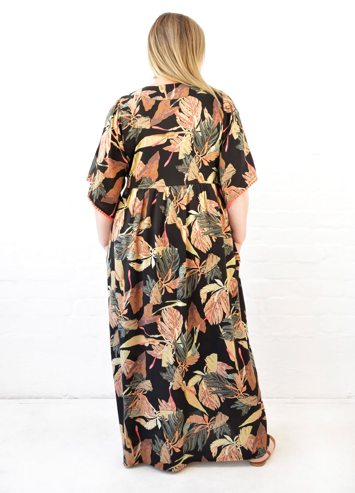 Clara kaftan dress in black Innerbloom print