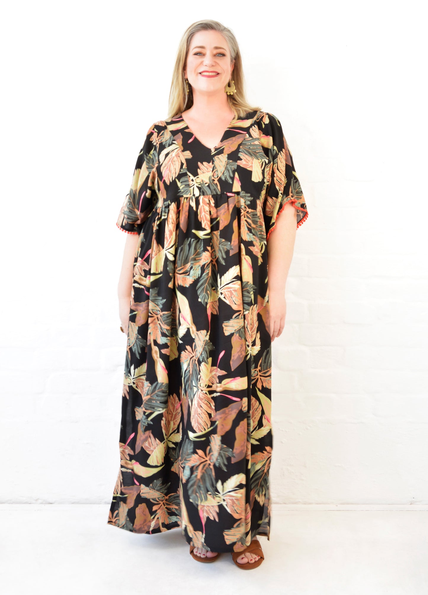 Clara kaftan dress in black Innerbloom print
