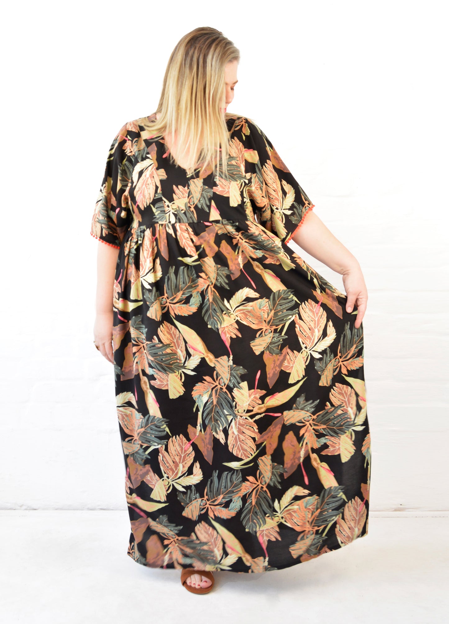 Clara kaftan dress in black Innerbloom print