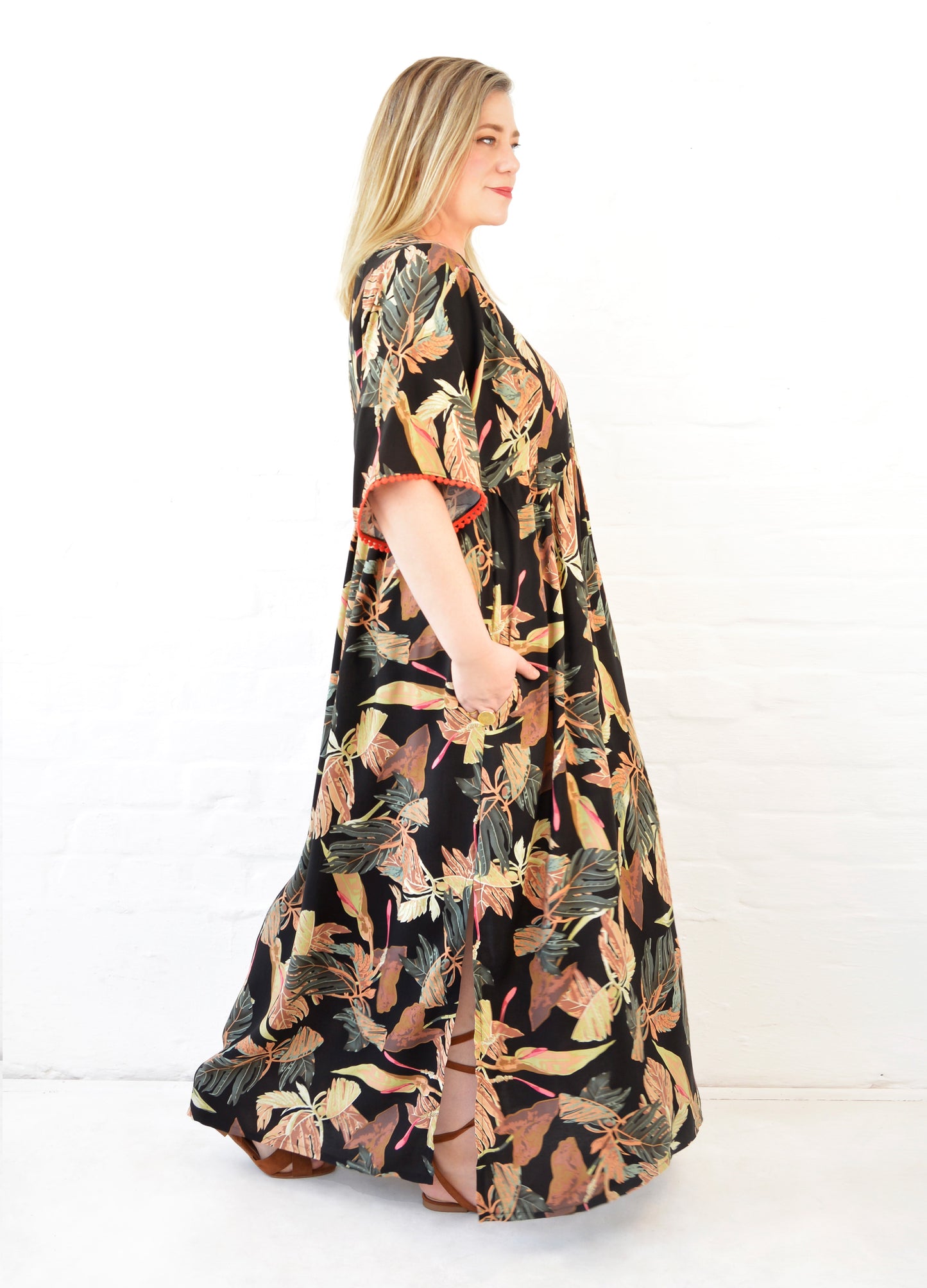 Clara kaftan dress in black Innerbloom print
